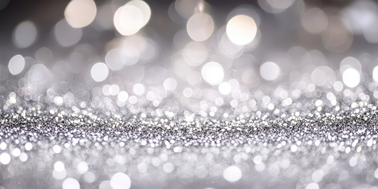 Sparkling silver bokeh background with shimmering lights creating a festive atmosphere for celebrations and events